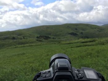 Scenic view of landscape against cloudy sky