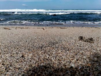 Surface level of beach against sky