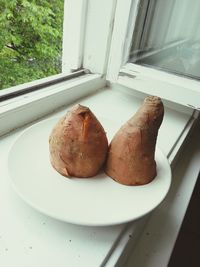 Close-up of bread on window sill