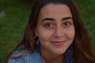 Close-up portrait of a smiling young woman