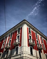 Low angle view of red building against sky