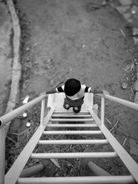 Rear view of man on staircase