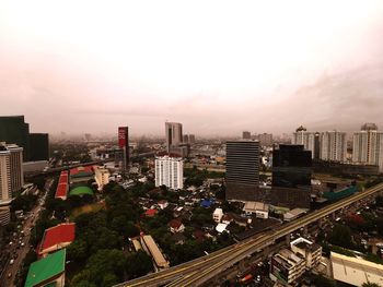 High angle view of buildings in city against sky