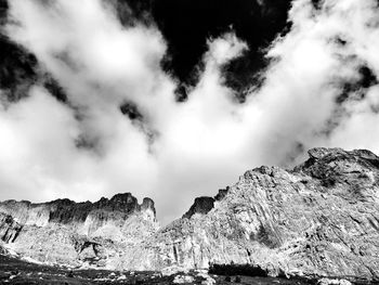 Scenic view of mountains against cloudy sky