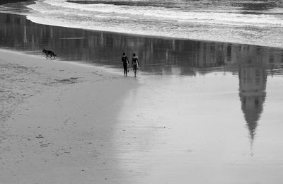 People walking on beach