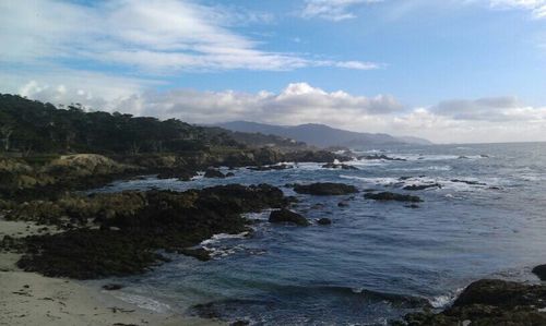 Scenic view of sea against cloudy sky