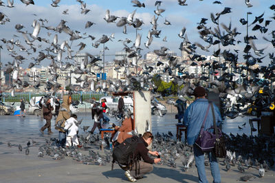 People at beach against sky