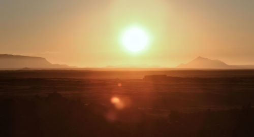 Scenic view of landscape against sky during sunset
