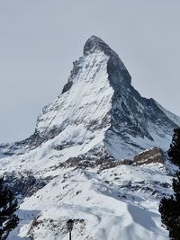 Scenic view of snowcapped mountains against clear sky