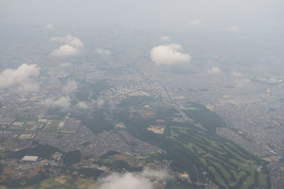 Aerial view of city against sky