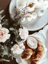 High angle view of white roses on table