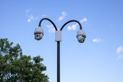 Low angle view of street light against sky