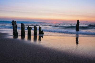 Scenic view of sea against sky at sunset