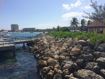 Panoramic view of sea and buildings against sky