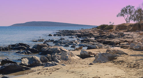 Scenic view of beach against clear sky