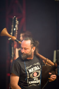 Man holding camera in music concert