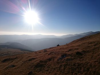 Sun shining over landscape