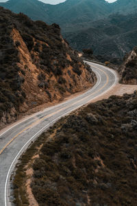 Country road leading towards mountain