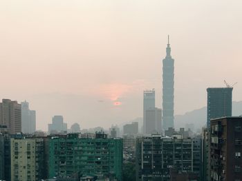 Cityscape against sky during sunset