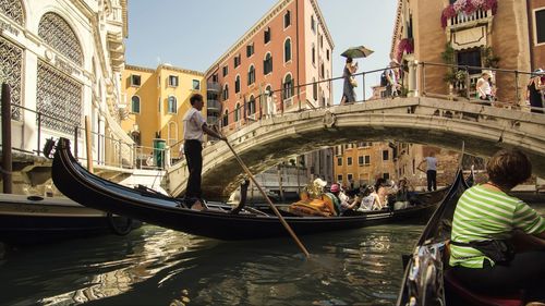 People on canal in city