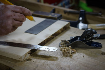 Close-up of man working on table