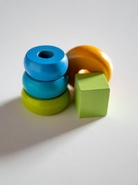 Close-up of toys on table against white background