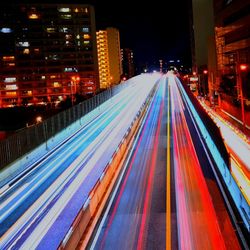 High angle view of light trails on road at night