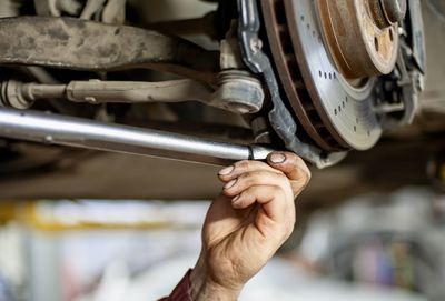 Close-up of man working at machine