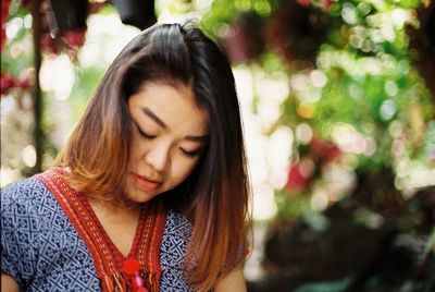 Portrait of a beautiful young woman with eyes closed