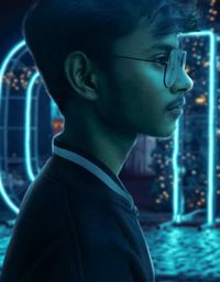 Close-up portrait of young man looking away