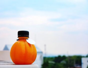 Close-up of yellow object against orange sky