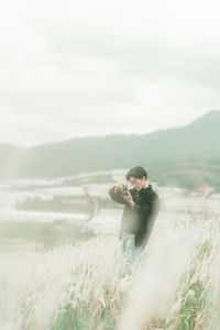 Portrait of man standing in the middle of white reeds