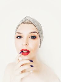 Portrait of a beautiful young woman over white background