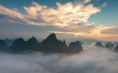 Scenic view of mountains against sky during sunset