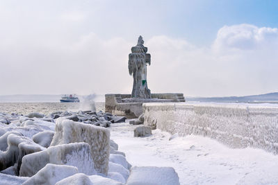 View of statue on snow covered land