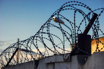 Low angle view of barbed wire