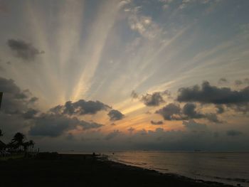 Scenic view of calm sea at sunset