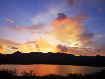 Scenic view of lake against sky during sunset