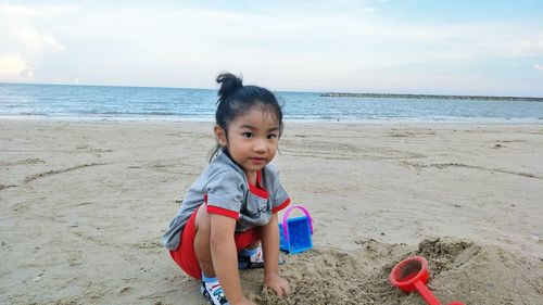 Cute girl playing at beach