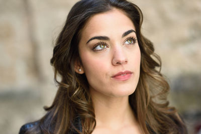 Close-up of beautiful woman looking away