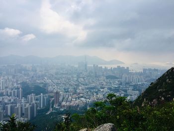 High angle view of buildings in city against sky