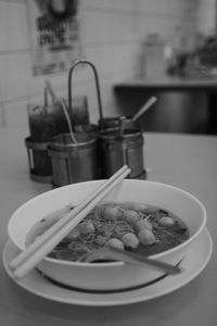 Close-up of cigarette in bowl on table