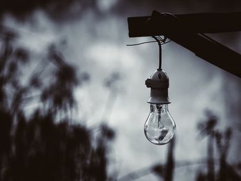 Low angle view of light bulb against sky