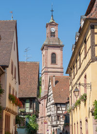 Low angle view of buildings in city against sky