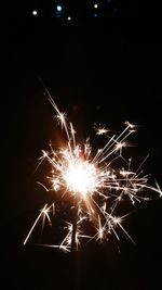 Close-up of firework display at night