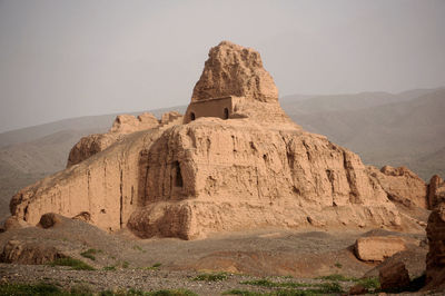 Rock formations on mountain against sky