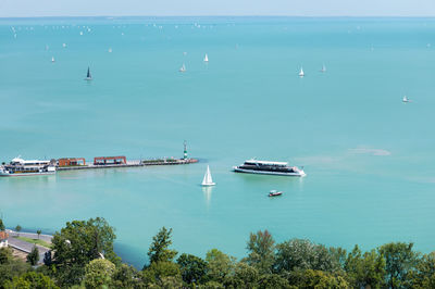 High angle view of sailboats in sea