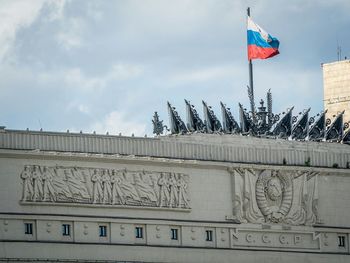Russian flag on duma building at manege square