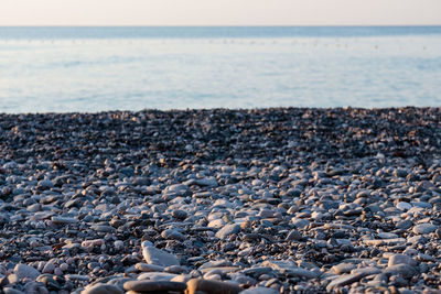 Rocks on beach against sky