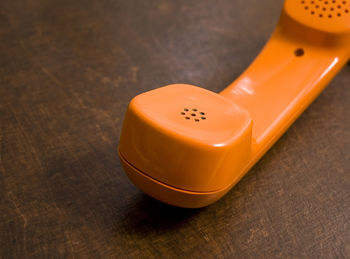 Close-up of telephone receiver on table